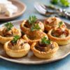 Crave Culinaire miniature savory hand pies bursting with caramelized onions and goat cheese